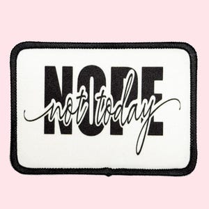 May include: White iron-on patch with black text that reads "NOPE not today".