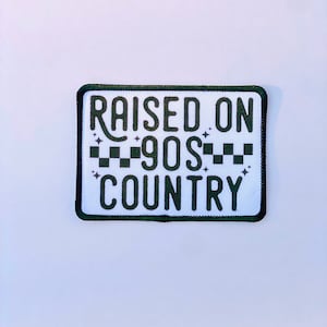 May include: Black and white iron-on patch with the text "RAISED ON 90s COUNTRY" in a black and white checkered pattern.