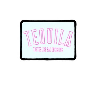 May include: White patch with black border featuring the text "TEQUILA" in pink outlined letters. Below the text is the phrase "TASTES LIKE BAD DECISIONS" in smaller pink letters.