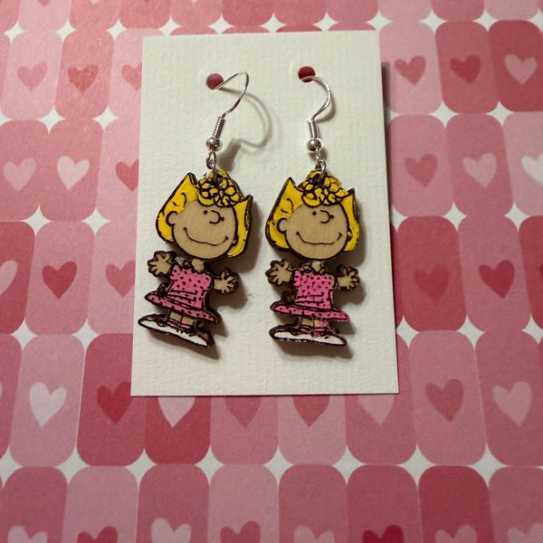Hand painted and cut pair of Sally Peanuts earrings.  Silver ear wires.