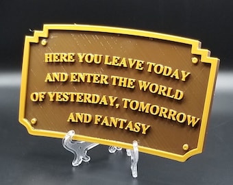 Può includere: Un cartello dorato con il testo "Here you leave today and enter the world of yesterday, tomorrow and fantasy".