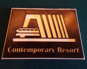 May include: A brown and white 3D printed sign with the text "Contemporary Resort" and a stylised image of a monorail train passing through a building.