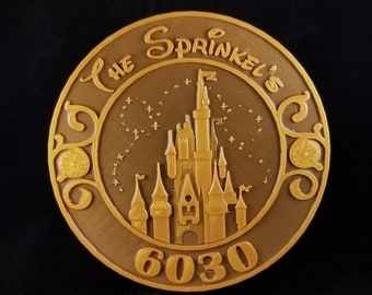May include: A gold-coloured metal sign with a stylised castle silhouette and the text "The Sprinkels 6030".