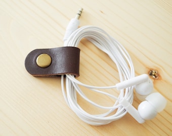 Cord Clip in Dark Brown > Solid Brass Snap > Full Grain Leather > Cord Keeper > Cord Organiser > Antique Brass Snap > Ear Bud Organiser