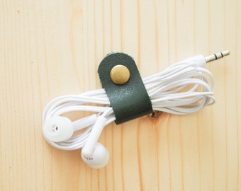 Cord Clip in Dark Green > Solid Brass Snap > Full Grain Leather > Cord Keeper > Cord Organiser > Antique Brass Snap > Ear Bud Organiser