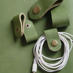 Cord Clip in Moss > Italian Nubuck > Full Grain Leather >Solid Brass Snap > Cord Keeper > Cord Organiser > Ear Bud Organiser > Cable Wrap