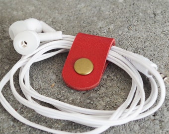 Cord Clip in Red > Solid Brass Snap > Full Grain Leather > Cord Keeper > Cord Organiser > Antique Brass Snap > Ear Bud Organiser