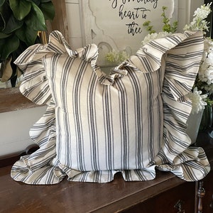 Cream and black stripe pillow cover with hemmed edge ruffle