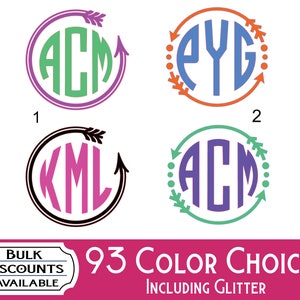 May include: Four circular monogram designs featuring three-letter initials in various colors. Design 1 has green letters in a purple arrow circle. Design 2 has blue letters in an orange arrow circle. Design 3 has pink letters in a black arrow circle. Design 4 has purple letters in a green arrow circle.