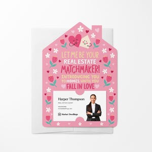 May include: Pink house-shaped card with a floral pattern and hearts. The card says "Let me be your real estate matchmaker! Introducing you to homes until you fall in love."  A business card with a photo of a woman is inside the house cutout. The business card says "Harper Thompson, Real Estate Agent, marketdwellings.com, Market Dwellings."