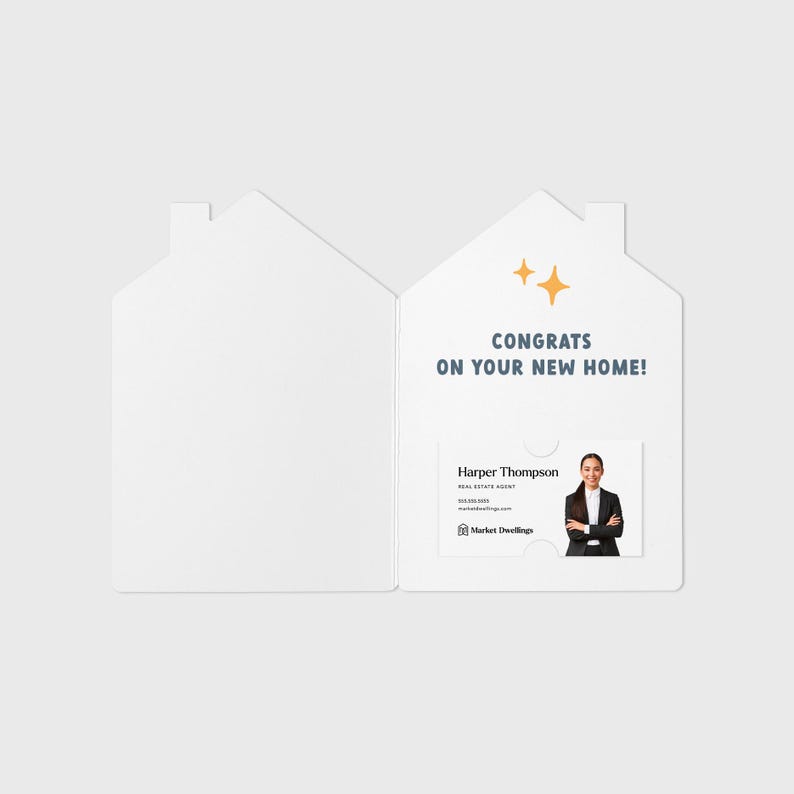 May include: A white house-shaped card with a gold star design and the text "Congrats on your new home!"  Inside the card is a business card with a woman's photo and the text "Harper Thompson, Real Estate Agent, Market Dwellings".