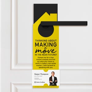 a yellow door hanger with a black handle