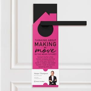 a pink door hanger with a black handle
