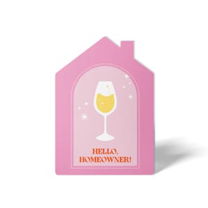 May include: Pink house-shaped card with a glass of champagne inside and the text "HELLO, HOMEOWNER!" in red and orange.