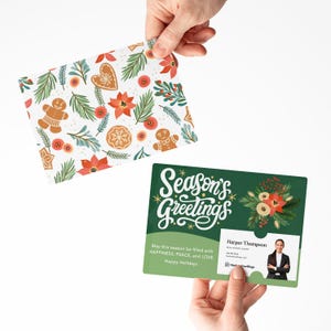 May include: Two Christmas greeting cards. One card has a pattern of gingerbread men, poinsettias, and foliage on white. The other is green with "Season's Greetings" and a business card slot.