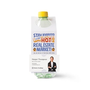 May include: A white plastic bottle holder with a clear plastic water bottle inside. The holder has a business card attached with the text "Stay Hydrated in this HOT Real Estate Market!" and a real estate agent's contact information.