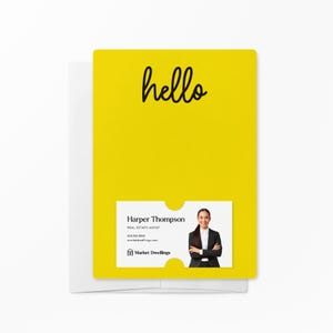 May include: A yellow card with the word "hello" written in black cursive. The card has a business card attached to it with the name "Harper Thompson" and the text "Real Estate Agent" in black text. The business card also has a photo of a woman with her arms crossed and a logo for "Market Dwellings".