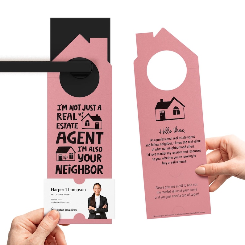 a pink door hanger with a picture of a house