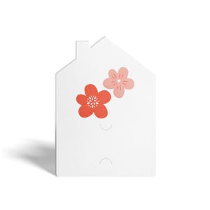 May include: White house-shaped card with two pink and red flowers. The card has two holes for hanging.