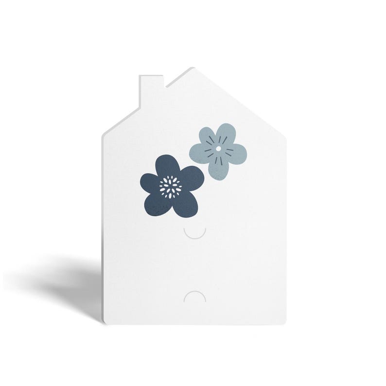 May include: White house-shaped wall decor with two blue floral designs. The house has two holes for hanging.