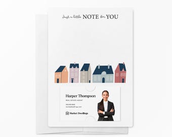 May include: A white notepad with the text "Just a little NOTE for YOU" at the top. The notepad has a row of colorful houses at the bottom. A business card with the text "Harper Thompson, REAL ESTATE AGENT" is attached to the notepad.