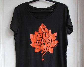 Camiseta de mujer negra "¿Quieres que sembramos?" Callograma Naranja - Tamaño S