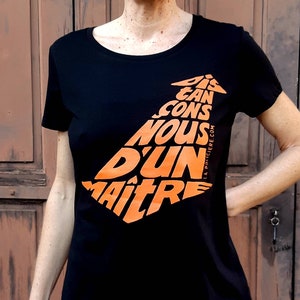 Women&#39;s T-shirt Black &quot;Let&#39;s distance ourselves from a master&quot; orange calligram Size M - Organic cotton