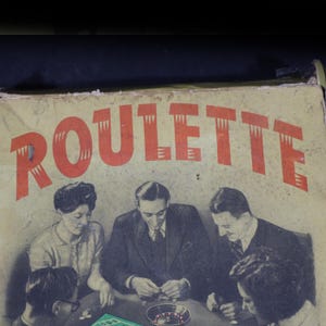 May include: A vintage cardboard game box featuring the word ROULETTE in large red letters. The box cover displays a black and white illustration of four people sitting around a table playing a game with a small roulette wheel and game chips.