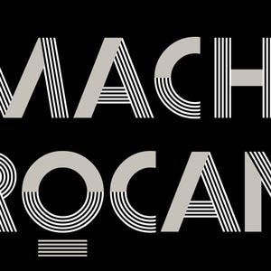 May include: A black rectangular sign featuring the text "LA MACHINE &Agrave; BROCANTES" in a stylized, art deco font. The text is in light grey, with the words stacked vertically. The background is black.
