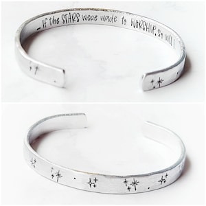 May include: Silver cuff bracelet with the inscription "If the STARS were made to WORSHIP. So will I." and a design of stars on the bottom.