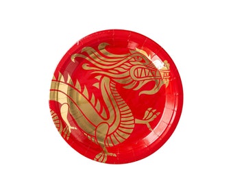May include: Red paper plate with a gold dragon design. The dragon is facing right and has a detailed design with scales and claws.