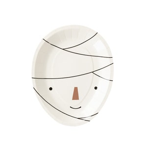 May include: Oval-shaped paper plate with a mummy face design. The plate is off-white with black lines mimicking bandages. It features two black dots for eyes, a brown nose, and a curved black line for a smile. A fun Halloween party supply.