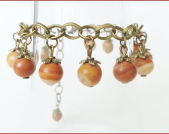 Bracelet fossilized wood holder bronze metal beads