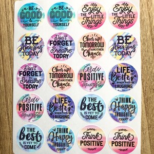 May include: A sheet of 16 colorful round stickers with positive affirmations and tie-dye patterns. The stickers feature phrases like "Be Good to Yourself", "Grow Positive Thoughts", "Think Happy Thoughts", and "Life is Better When You're Laughing".