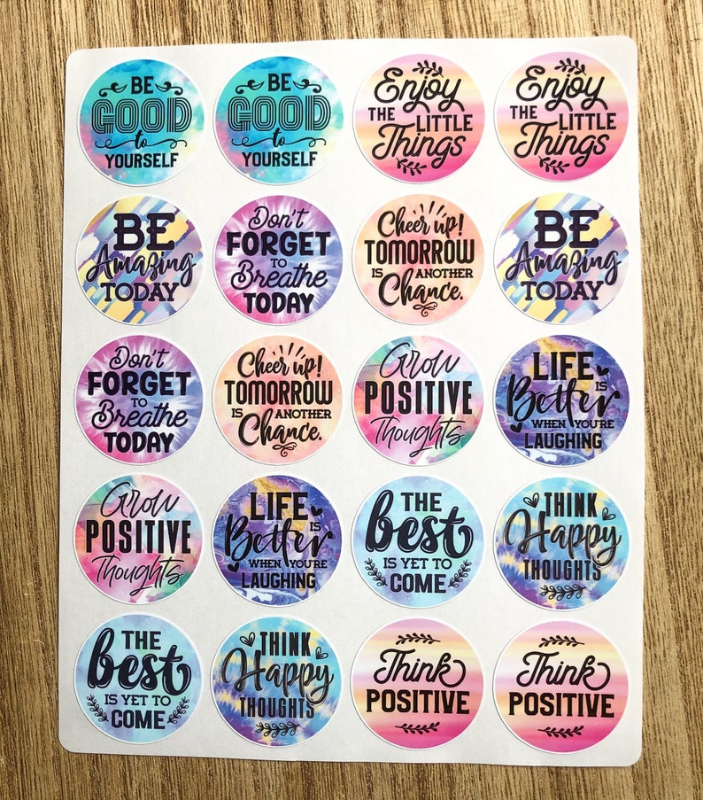 May include: A sheet of 16 colorful round stickers with positive affirmations and tie-dye patterns. The stickers feature phrases like "Be Good to Yourself", "Grow Positive Thoughts", "Think Happy Thoughts", and "Life is Better When You're Laughing".