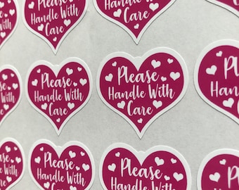 Pegatinas de corazón rosa con la frase "Manipular con cuidado": Etiquetas de embalaje