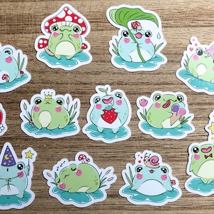 May include: A set of 12 frog stickers with various designs. The frogs are green and blue with different expressions and accessories. Some frogs are wearing crowns, eating strawberries, holding ice cream cones, or sleeping. The stickers are perfect for adding a touch of whimsy to journals, laptops, water bottles, and more.