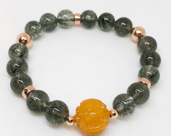Butterscotch Amber Sphere with handcarved Longetivity symbols and High clarity Green Rutilated Quartz beads & 14k Rose Gold Spacers.