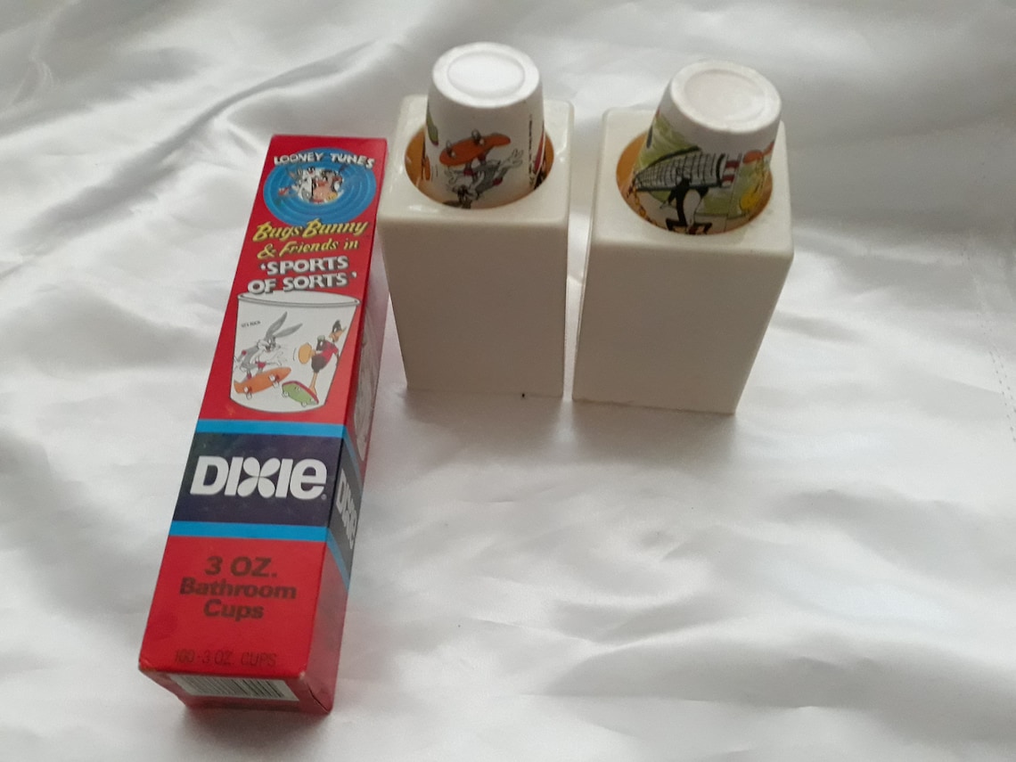 Vintage Dixie 3oz Bathroom Cups Dispensers and box of 3oz Looney Tunes