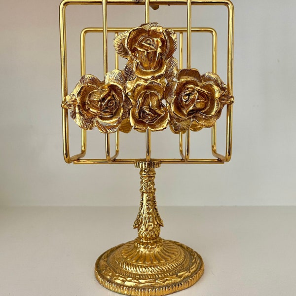 Metal gilt gold tone Stylebuilt ormolu Hollywood regency napkin towel mail holder. Roses marked Stylebuilt Made in USA.