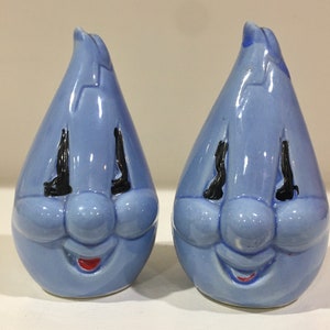 Handy flame anthropomorphic salt and pepper shakers. blue gas co flame shakers with smile faces.