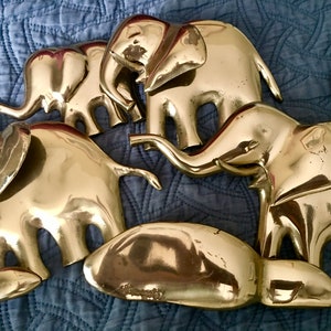 Bijan 1980 brass elephants sculpture folding wall hanging. Signed by artist metal wall art. has wear see pictures
