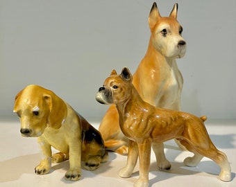 Imperfect dog figurines. Arnart Great Dane S8370, Mortens Studio Beagle, Goebel W. Germany boxer CH578. Read condition.  sold separately