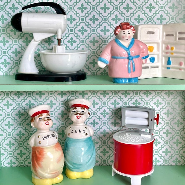 Salt and Pepper shakers. mixer, wringer washer, clay art lady and refrigerator, chefs.