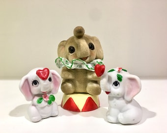 Flocked Josef Originals Japan circus elephant with collar, kitschy ceramic heart trunk elephant figurine pair. trunk up. Sold separately