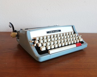 Privileg typewriter blue grey black with case vintage midcentury travel typewriter design kidney table space age typography