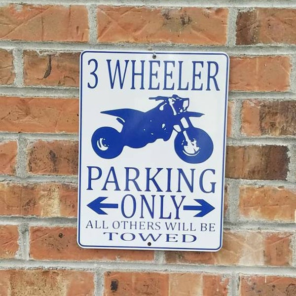 three wheeler atc parking only sign blue on white