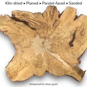 May include: A light brown, irregular wood slab with visible growth rings and dark grain patterns. The text at the top reads: Kiln-dried • Planed • Paralel-faced • Sanded. The text at the bottom reads: dampened to show grain.