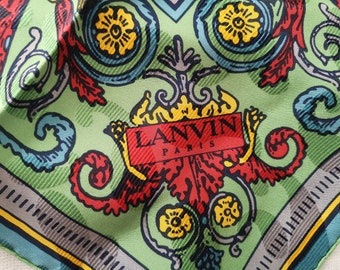 May include: A green silk scarf with a colorful floral pattern and a red label that says "LANVIN PARIS".
