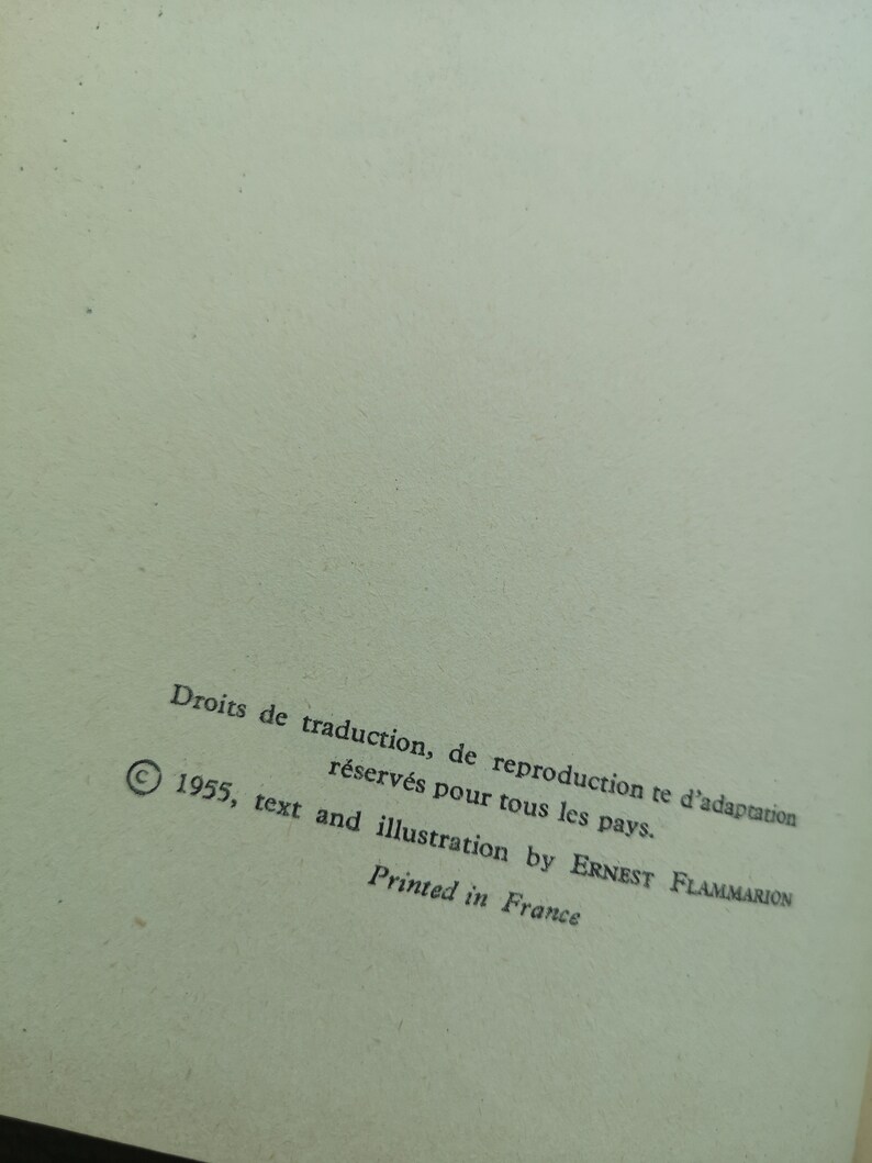 Może przedstawiać: Strona praw autorskich z tekstem "Droits de traduction, de reproduction te d'adaptation r&eacute;serv&eacute;s pour tous les pays. 1955, text and illustration by ERNEST FLAMMARION Printed in France".
